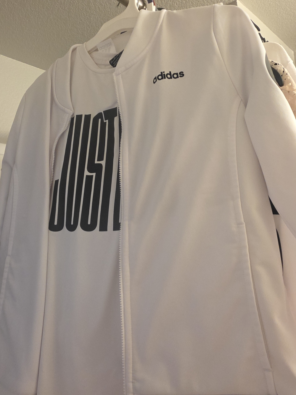 Adidas White Zip-Up Jacket with Bold Black Graphic